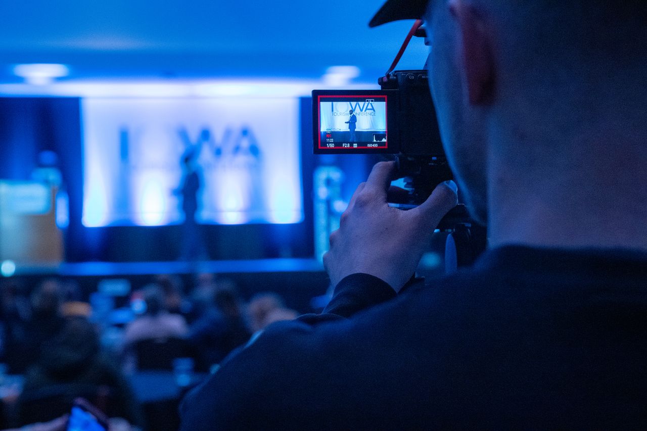 services-01 Capturing a conference event with a focus on professional videography services.